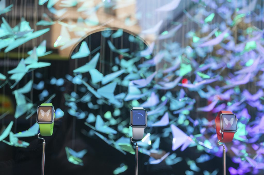 LONDON, UK - APRIL 10, 2015: Apple Watches with windows decoration on background in new Apple Watch store at Selfridges in Oxford. It is one of first three official stores in the world.