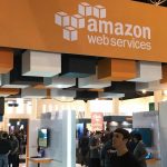 amazon web services sign over an open-plan office