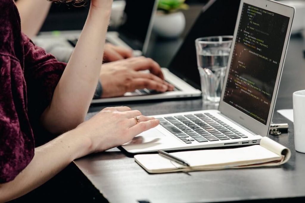 woman-writing-code (1) | BetaKit