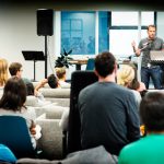 Greg Smith of Thinkific addressing team at Thinkific HQ
