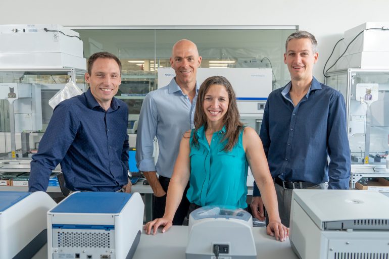 AbCellera's leadership team in a company lab