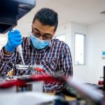 A person building Nicoya's portable COVID-19 test