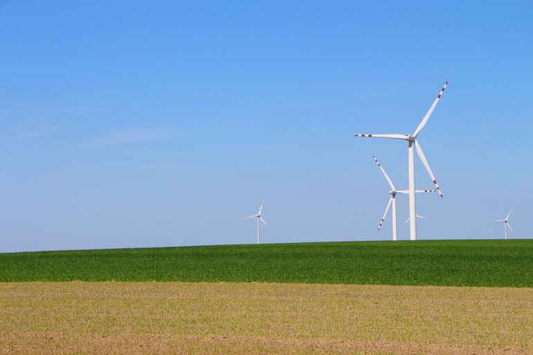 Wind turbines in an open field