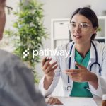 A doctor talking to a patient. The pathway logo is on top of the entire image.