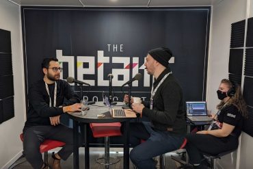 Anthony Mouchantaf sitting across Douglas Soltys while they record the BetaKit podcast.