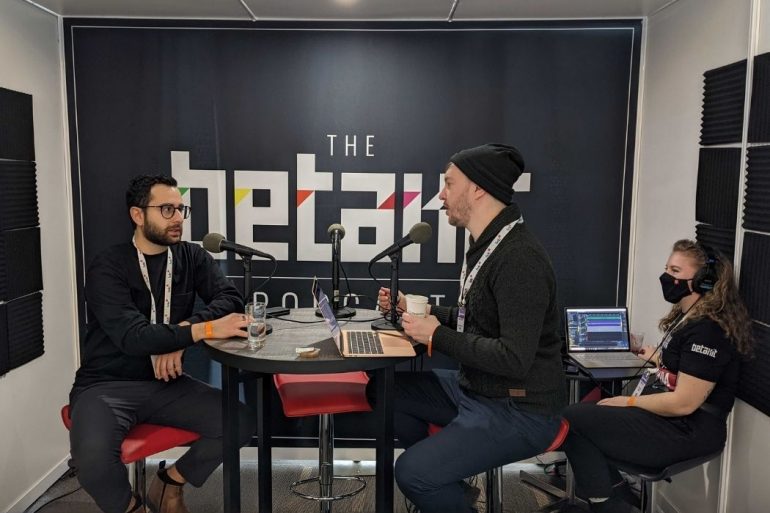 Anthony Mouchantaf sitting across Douglas Soltys while they record the BetaKit podcast.