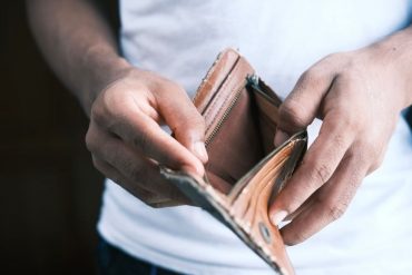 Person opening empty wallet