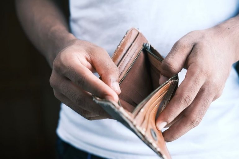 Person opening empty wallet