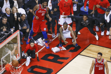 Kawhi Leonard crouches after hitting a buzzer beater.