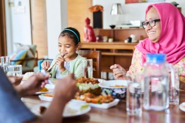Family sitting together for dinner.