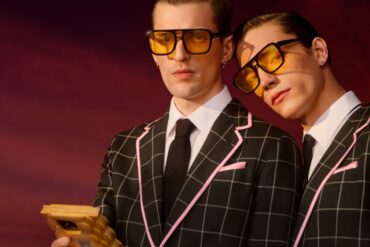 Two men wearing glasses