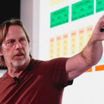 Jim Keller pointing at a graph