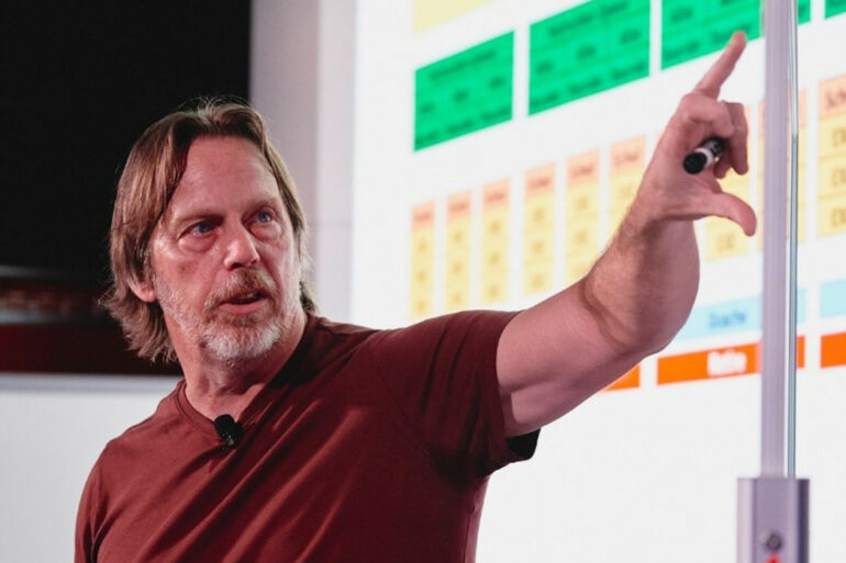 Jim Keller pointing at a graph