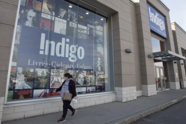 Woman walking in front of Indigo