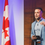 NACO CEO Claudio Rojas speaking at a 2023 event.