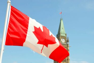 Canadian flag over Parliament Hill