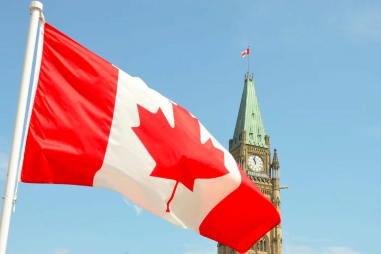 Canadian flag over Parliament Hill