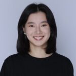 Amy Ding centered in the frame, smiling