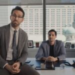 Ryan Reynolds leaning on Nuvei CEO Phil Fayer's desk