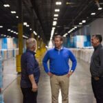 Former Gildan CEO Vince Tyra visits a factory