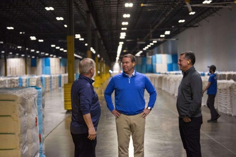 Former Gildan CEO Vince Tyra visits a factory
