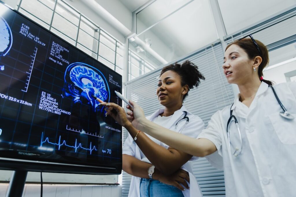 Team of doctors check on scan results