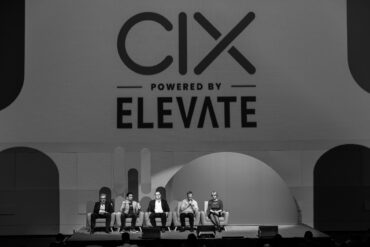 on stage panel at 2024 CIX. black and white