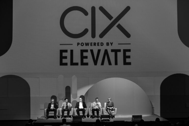 on stage panel at 2024 CIX. black and white