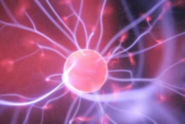 artist rendering of an atom in purple and blue