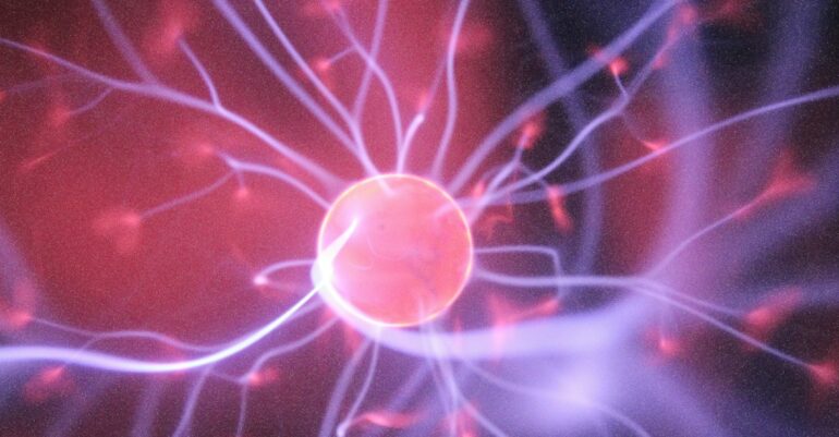artist rendering of an atom in purple and blue