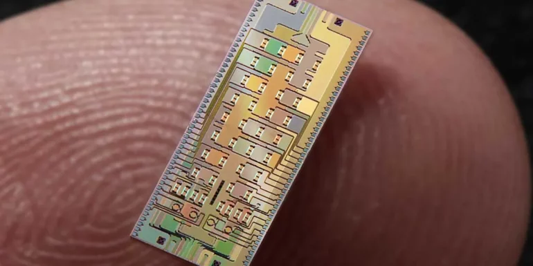 a tiny chip on a human thumb