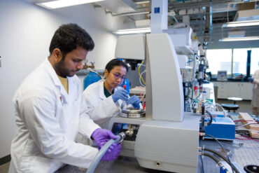 Two UCalgary researchers in a lab