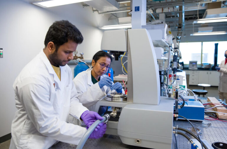 Two UCalgary researchers in a lab