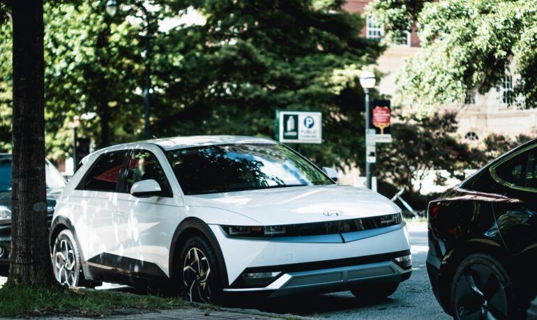 a white car parked on the side of the road
