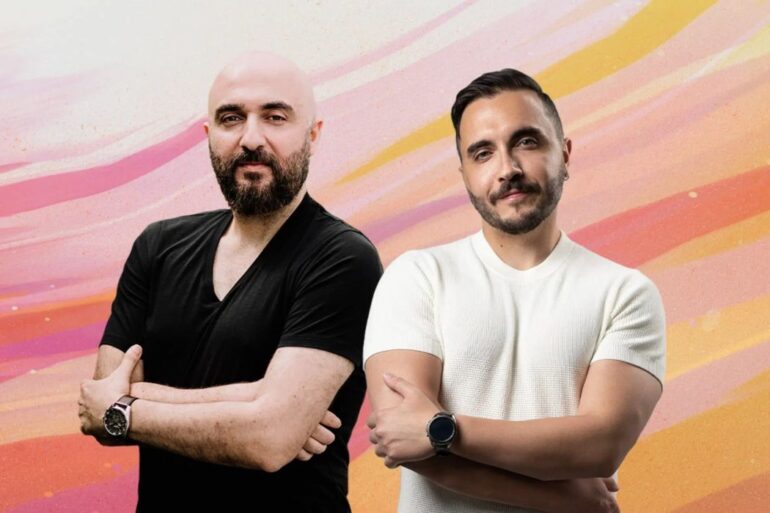 Airalo founders pose in front of painted artistic background