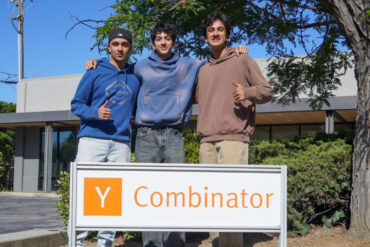 three founders of opennote pose in front of y combinator sign