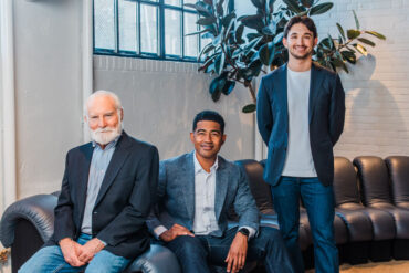 Jeffrey Gettleman, Jimoh Ovbiagele, and Maxim Isakov pose in an office