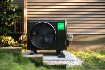 A Jetson heat pump sitting outside atop a concrete slab