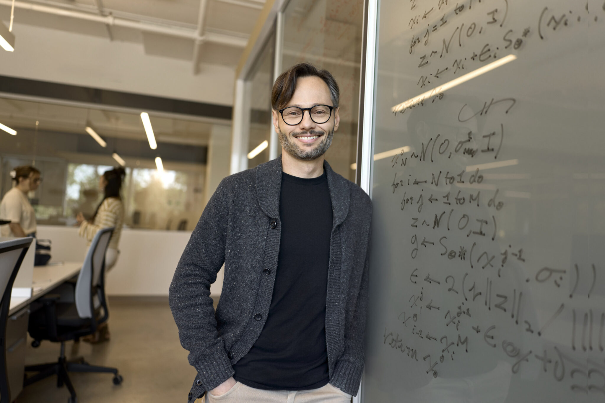 Mila Quebec AI Institute Hugo Larochelle | BetaKit Hugo Larochelle leans against a white board.