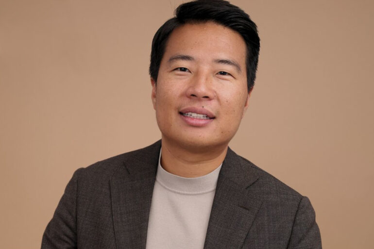 A headshot of Steven Wang