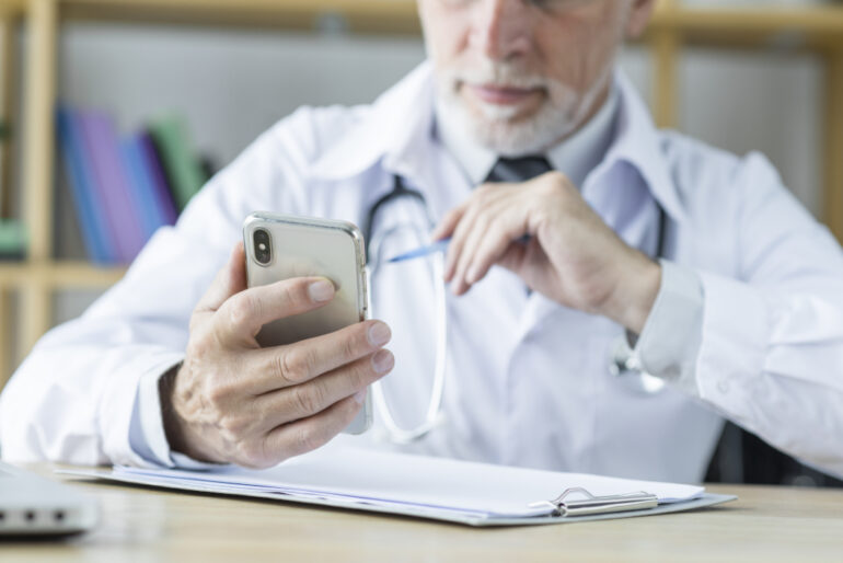 A doctor using a smartphone