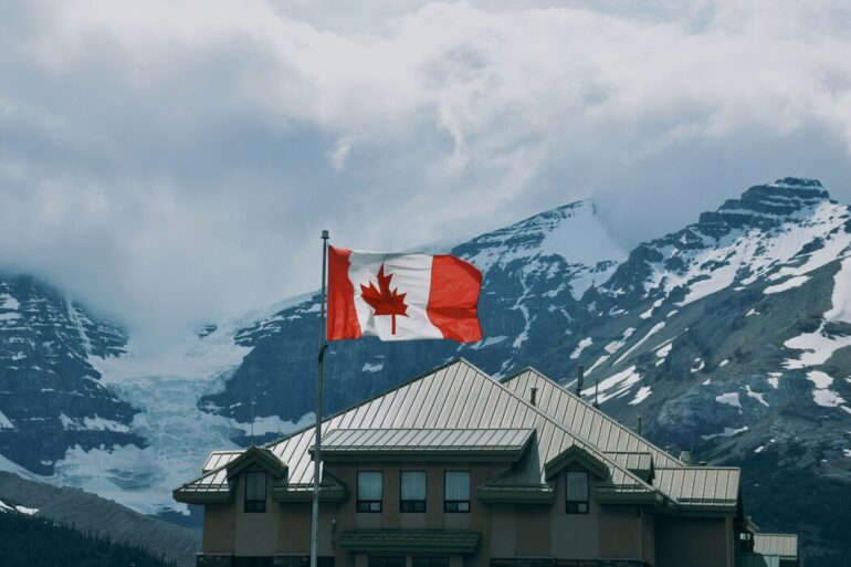 flag in front of snowy mountains