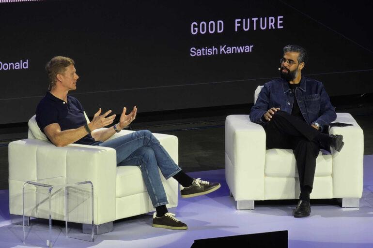 Andrew Macdonald and Satish Kanwar on stage Toronto Tech Week's Homecoming event.