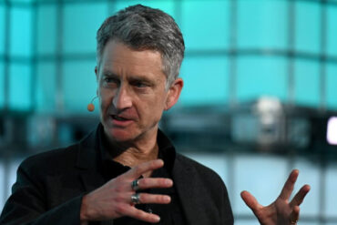 Vince Beiser on stage at Web Summit Vancouver
