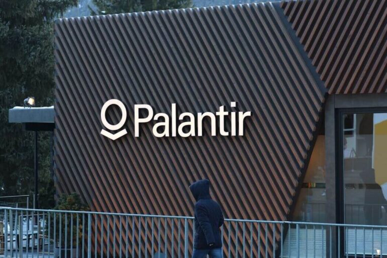 The facade of a building with a Palantir logo on it.